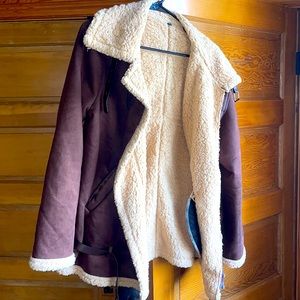 Super warm and lightweight. Interesting piece.